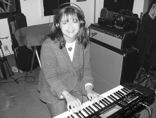 Suzanne in the studio recording Get a Gun 